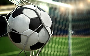 time lapse photography of kicked soccer ball in goal HD wallpaper
