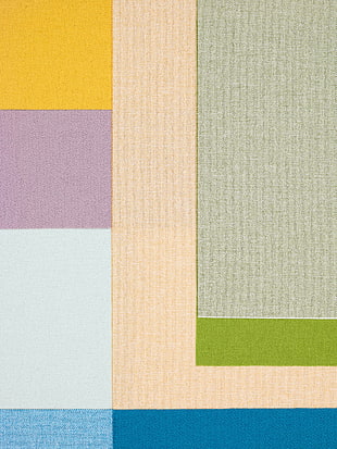 beige, green, grey, yellow, purple, and blue textile