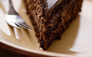 sliced chocolate cake on white ceramic plate