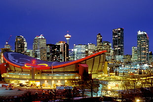 photography of round beige and blue stadium, calgary, downtown