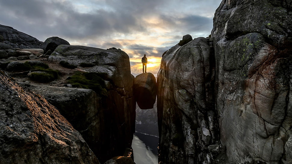 gray rock monument, rock, men, river, sunset HD wallpaper