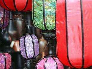 assorted color hanging lanterns with black metal frame