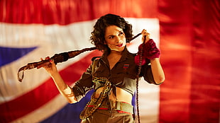 woman wearing brown crop top holding brown rope