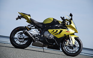 yellow and black BWM sports motorcycle