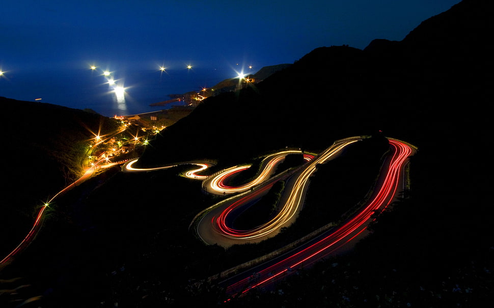 time lapse photography of spiral road at nighttime HD wallpaper
