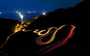 time lapse photography of spiral road at nighttime