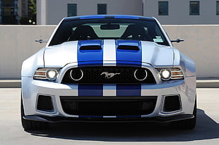 white and blue Ford Mustang coupe