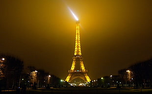 Eiffel tower during night time HD wallpaper