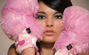 woman holding pink fur boxing gloves HD wallpaper