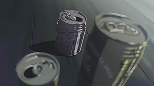 two green and one gray aluminum cans, 5 Centimeters Per Second