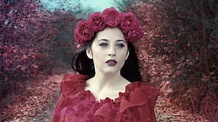 woman wearing red top with flower hair vines