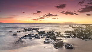 rocks on seashore during golden hour HD wallpaper