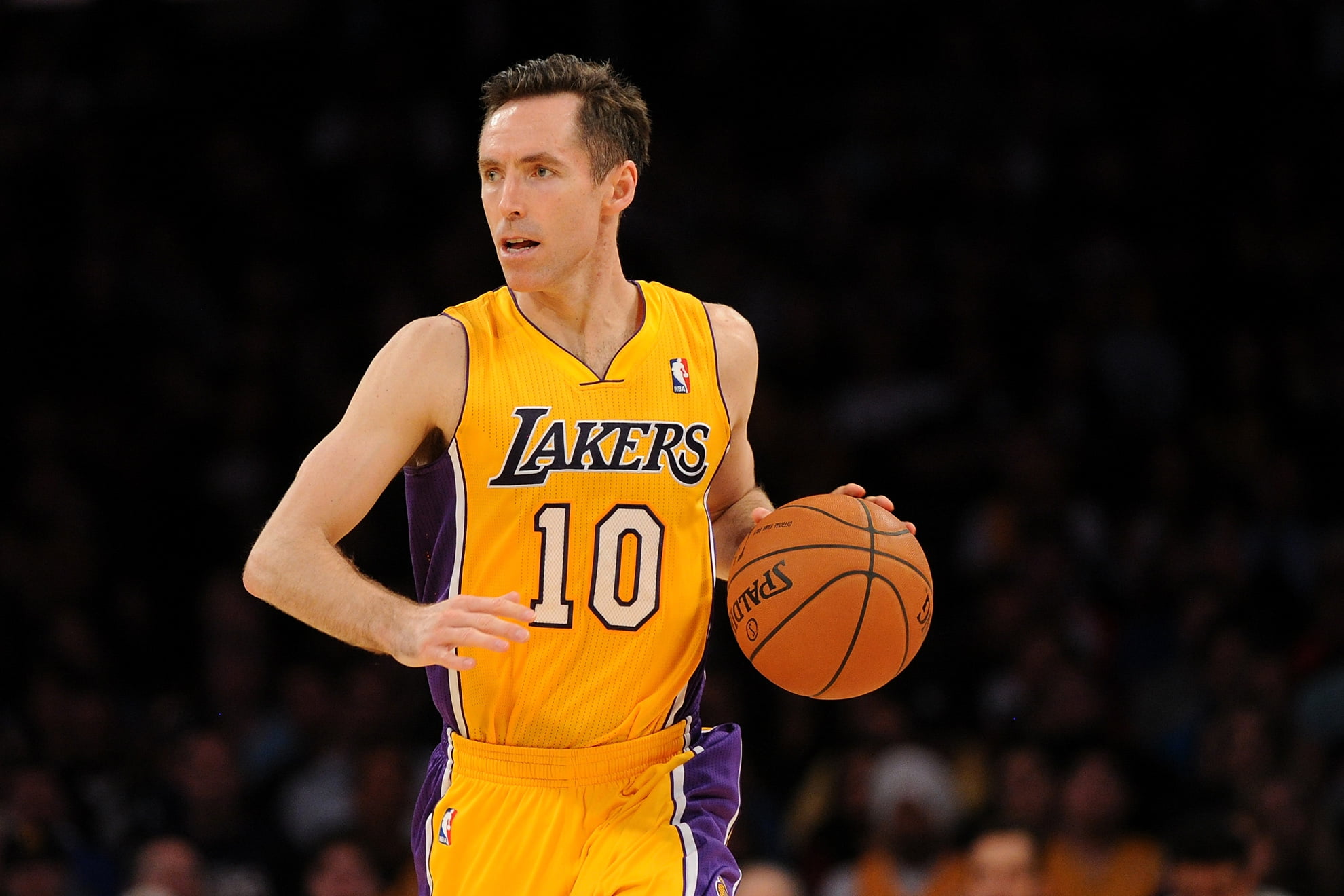Los Angeles Lakers no. 10 player dribbling Spalding ball