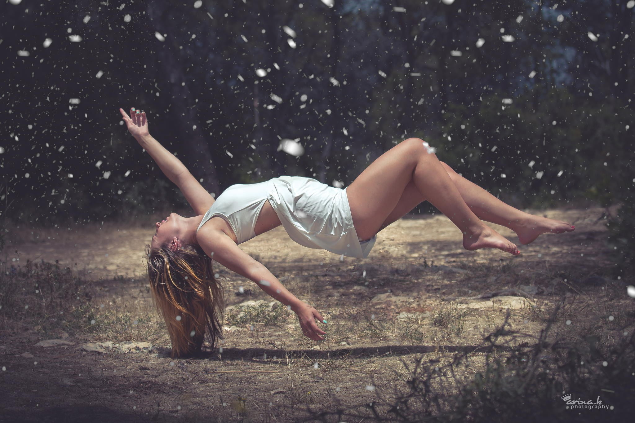 floating woman wearing white top