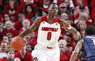 man wearing white and red Louisville 0 basketball jersey