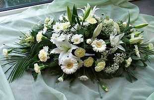 white Gerbera and Lily flowers centerpiece