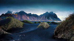 brown rocky mountain, mountains, beach, black, sand HD wallpaper