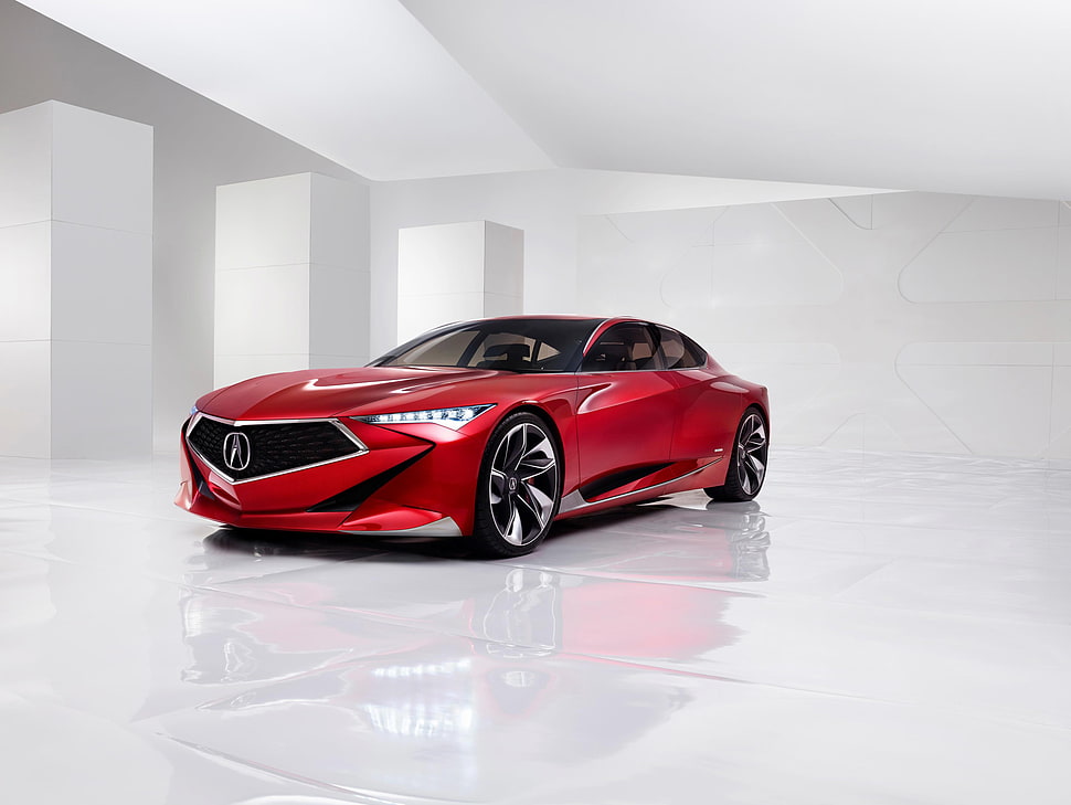 red Acura sports car on white room HD wallpaper