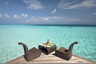 brown wicker outdoor table set, sea, tropical