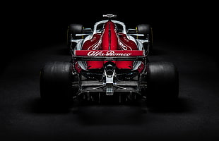 red and black Alfa Romeo go-kart