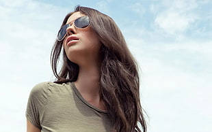 woman wearing aviator-style sunglasses and gray scoop-neck tops