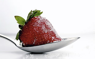 red strawberry on stainless steel spoon HD wallpaper