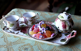 white-and-multicolored floral tea set