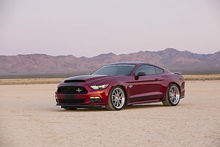red Ford Mustang on brown soil HD wallpaper