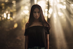 selective focus photography of woman wearing black off-shoulder top