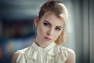 woman wearing white ruffled sleeveless top in macro shot