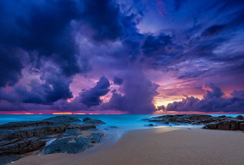 brown sand beach with blue sky and cloud photo, thailand