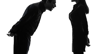 silhouette of man front of woman
