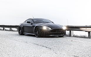 black coupe with open headlights HD wallpaper
