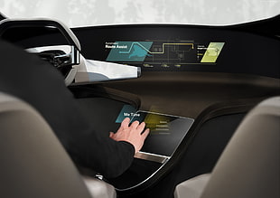 person sitting inside car touching monitor HD wallpaper