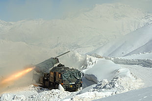 grey rocket tank on snow covered ground