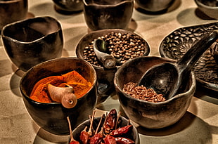 photo of filled black ceramic bowls