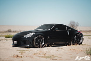 black coupe on the desert