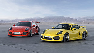 two yellow and red coupes, Porsche 911 GT3 RS, car, Porsche Cayman GT4, red cars