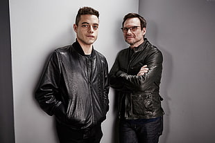 two men in black leather jackets