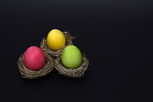 three red-yellow-and-green egg on brown hays HD wallpaper