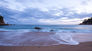 panoramic photography of beach and stones