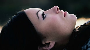 close up photo of woman wearing black eyeliner