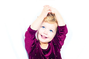 child wearing purple velvet long-sleeved shirt HD wallpaper