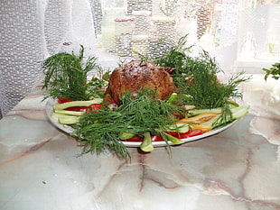 photo of roasted chicken with garnishing