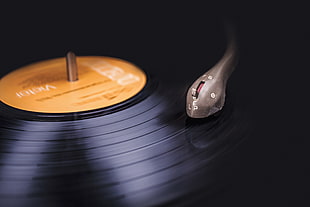 close photo of playing vinyl record