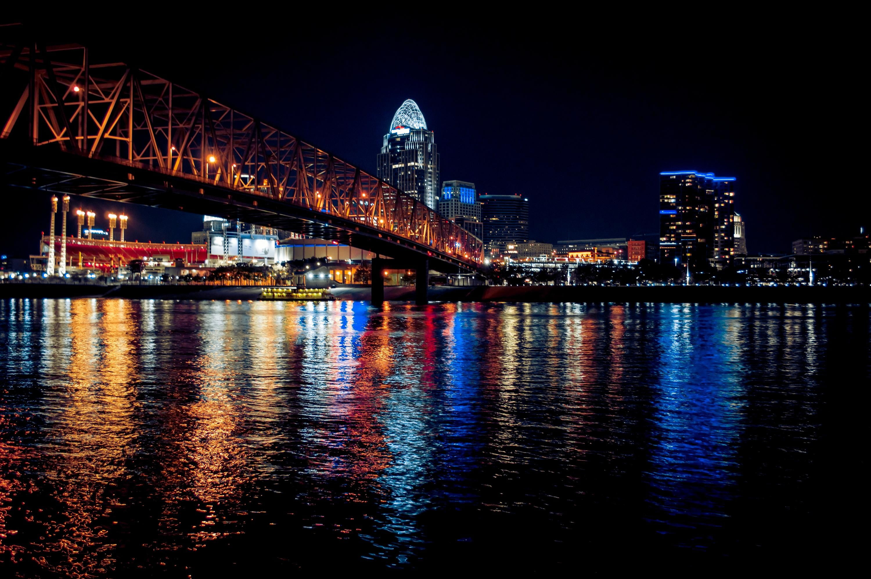 brown truss bridge, city, bridge, lights, water