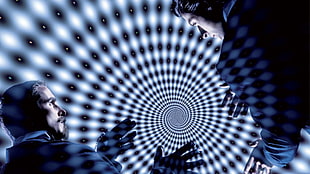 two man talking with spiral background