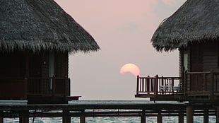 two brown wooden nipa huts, house, sea, sunset