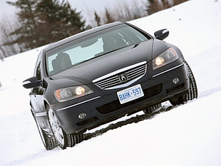black Acura RL on snow
