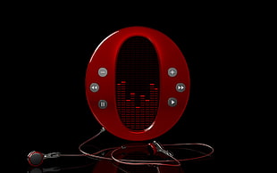 oval red speaker with red earphones